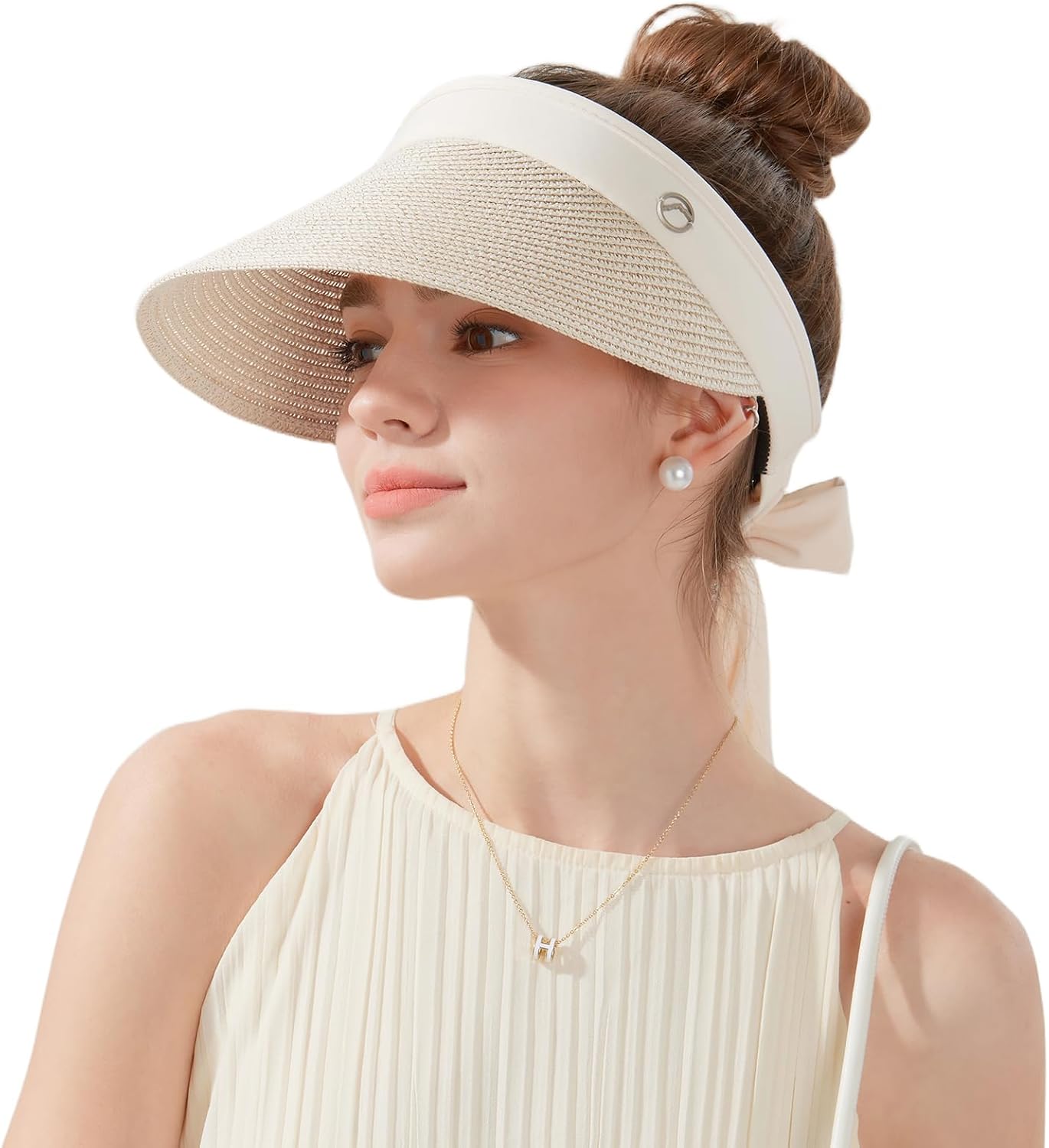 Wide-brimmed straw beach hat; hat designed for ponytails