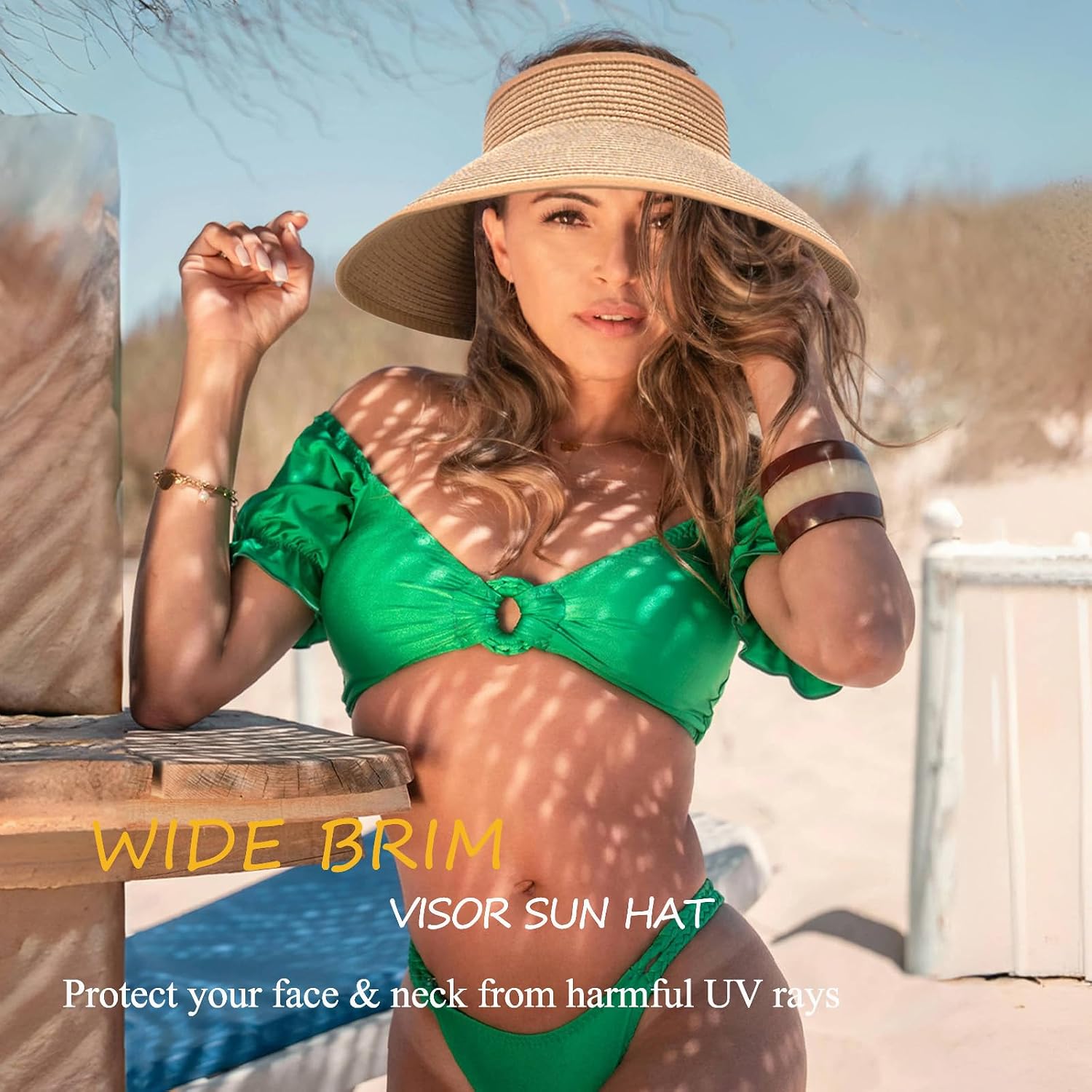 Wide-brimmed straw beach hat; hat designed for ponytails